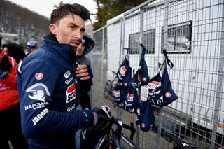 Julian Alaphilippe bundles up after a cold stage 5 at Tirreno-Adriatico