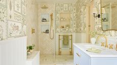 A large shower room with tiger-themed wallpaper, a glass shoer screen, pink shower tiles, and brass fixtures