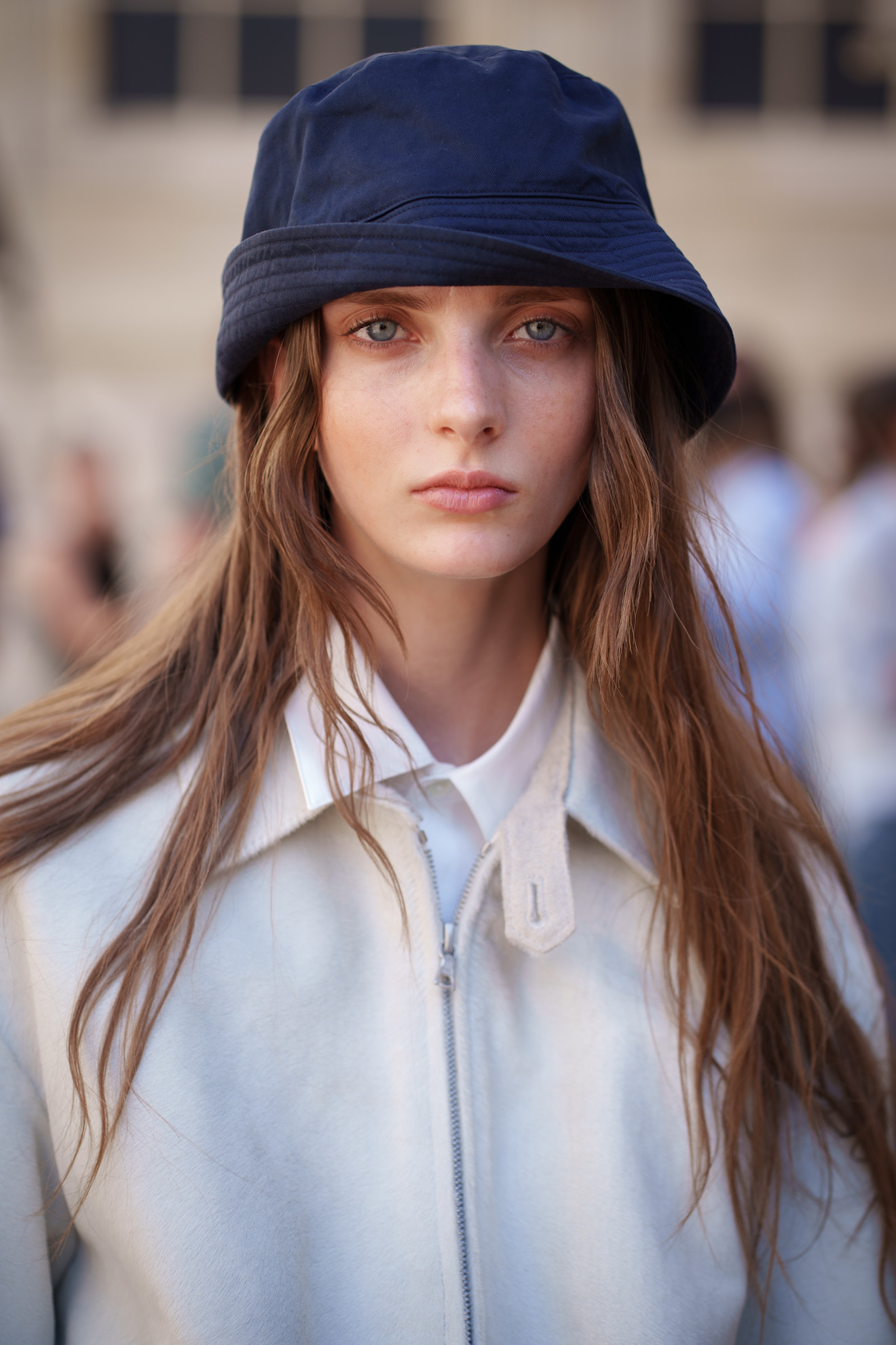 A model with their hair cut into a butterfly cut.