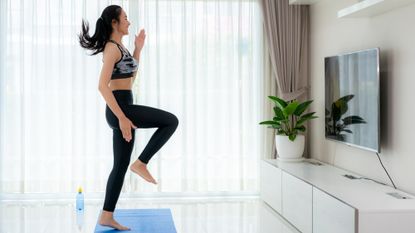 Woman doing a cardio workout at home