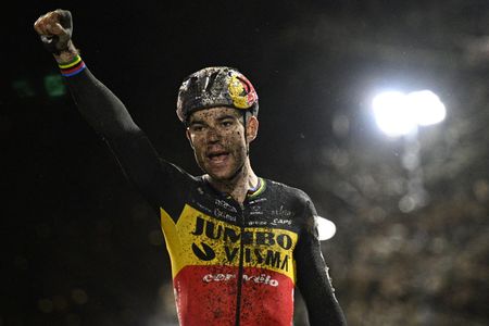 Wout Van Aert celebrates as he crosses the finish line to win the men elite race of the Superprestige Diegem 