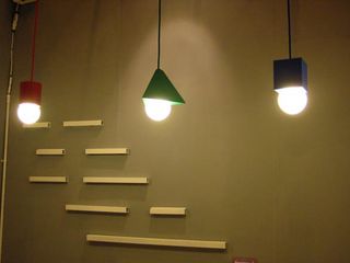 Three ceiling light in three different shapes and colours