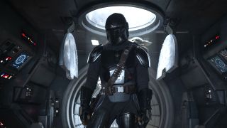 Mandalorian (Pedro Pascal) and Grogu in Lucasfilm's THE MANDALORIAN AND GROGU.