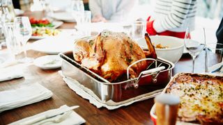 Turkey in roasting pan on the table