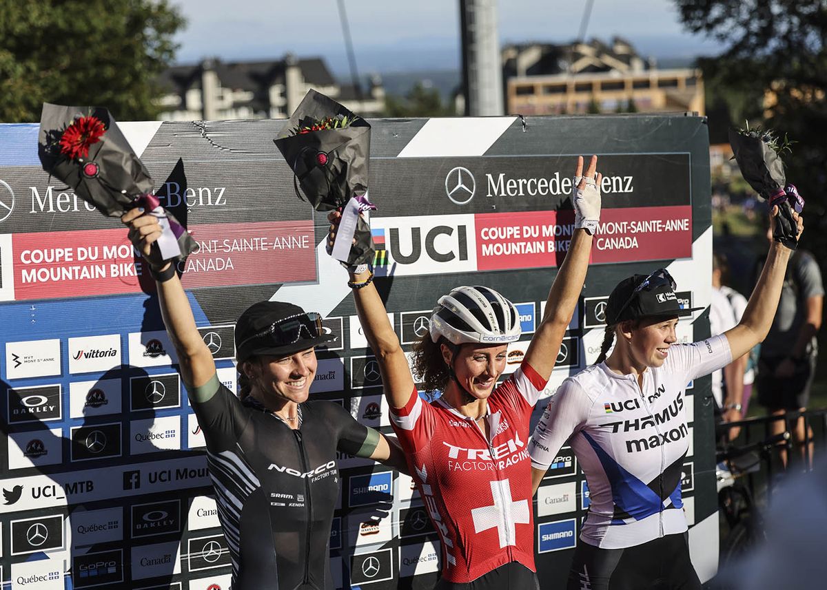 Jolanda Neff (Trek Factory) take centre stage on the podium of the XCC race at the UCI MTB World Cup Mont-Sainte-Anne