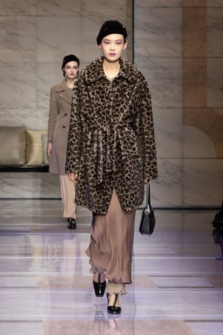 Woman in leopard print jacket at Armani show