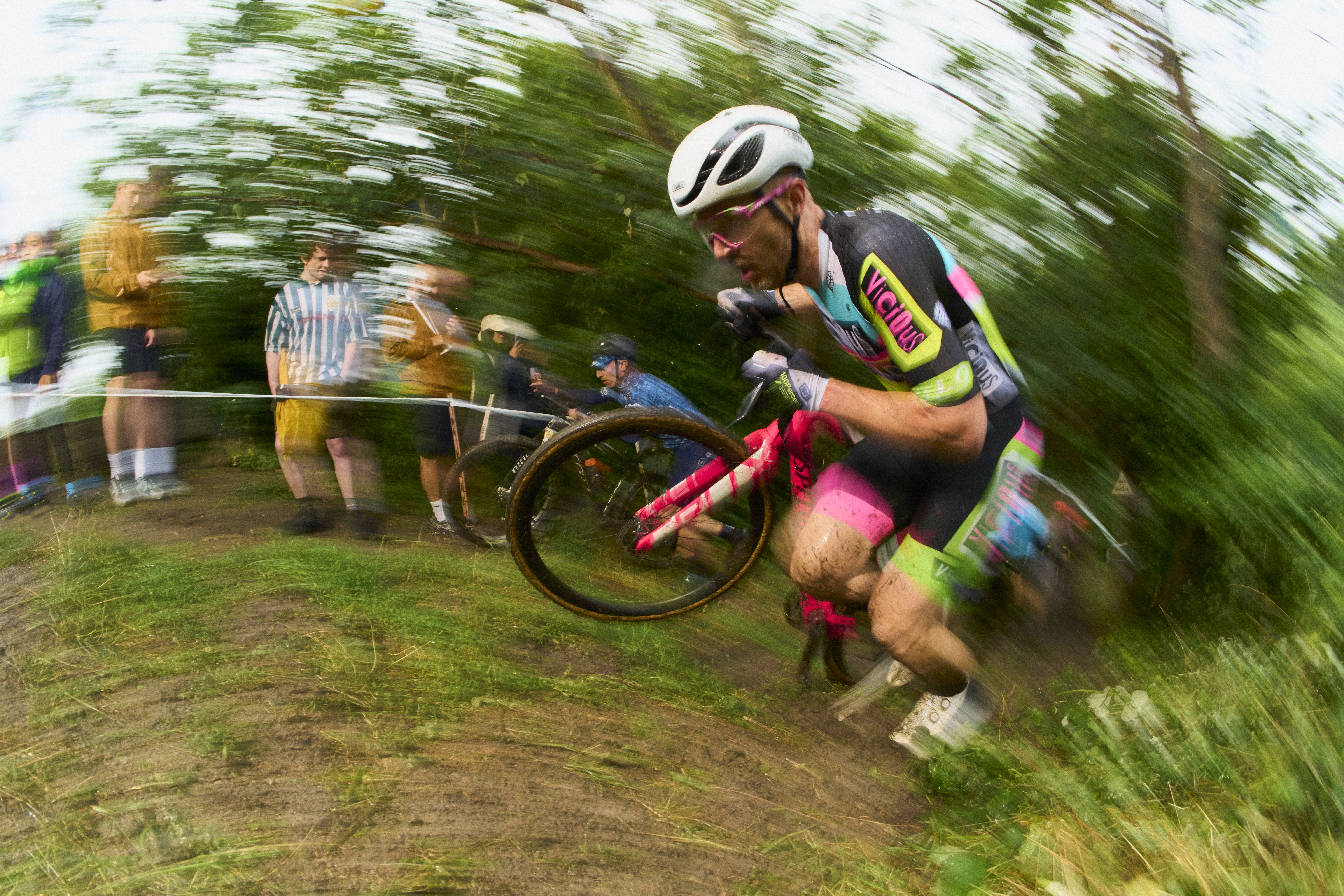 A man pushes a bike uphill