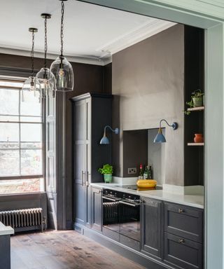 grey kitchen with brown walls and wood floors