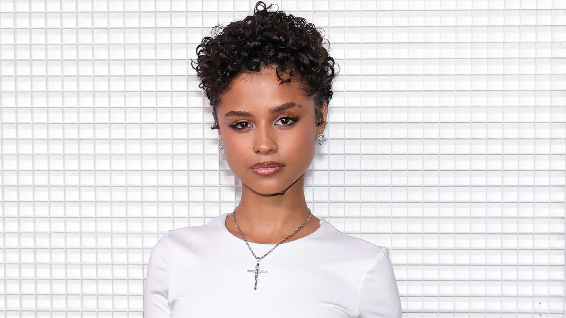Tyla with a pixie haircut and wearing a white t-shirt