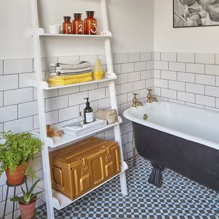 bathroom with bathtub and tiled walls