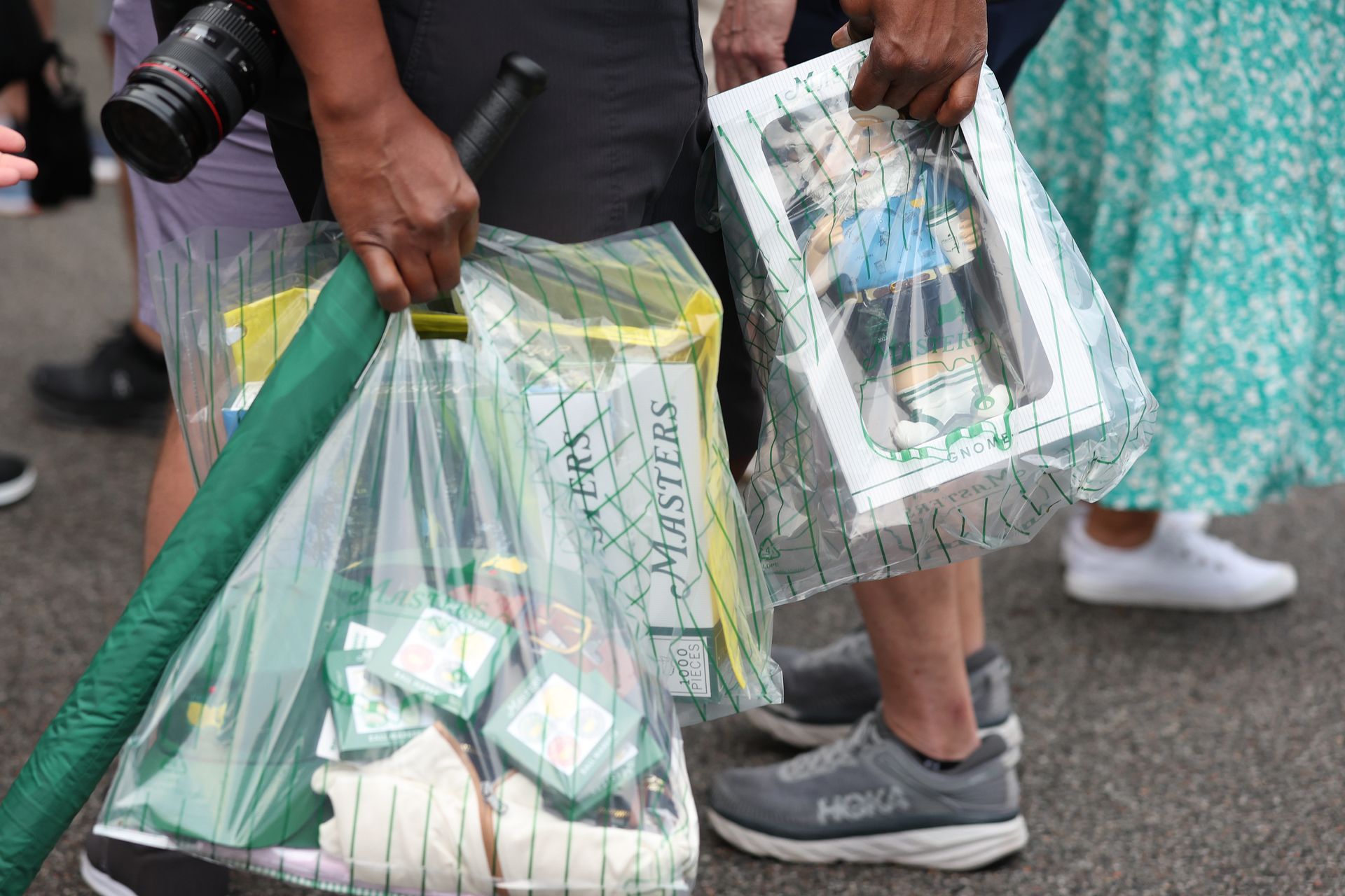Plastic bags seen with Masters merch inside