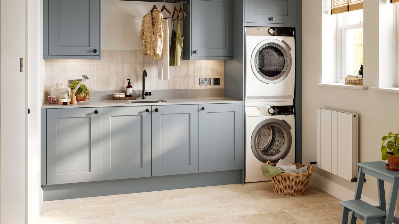 blue laundry room with washer and dryer