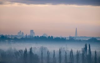 City of London in distance on misty morning