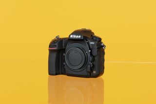 Nikon D850 on a yellow background
