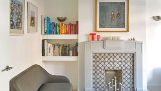 a fireplace with chunky shelves in the alcove