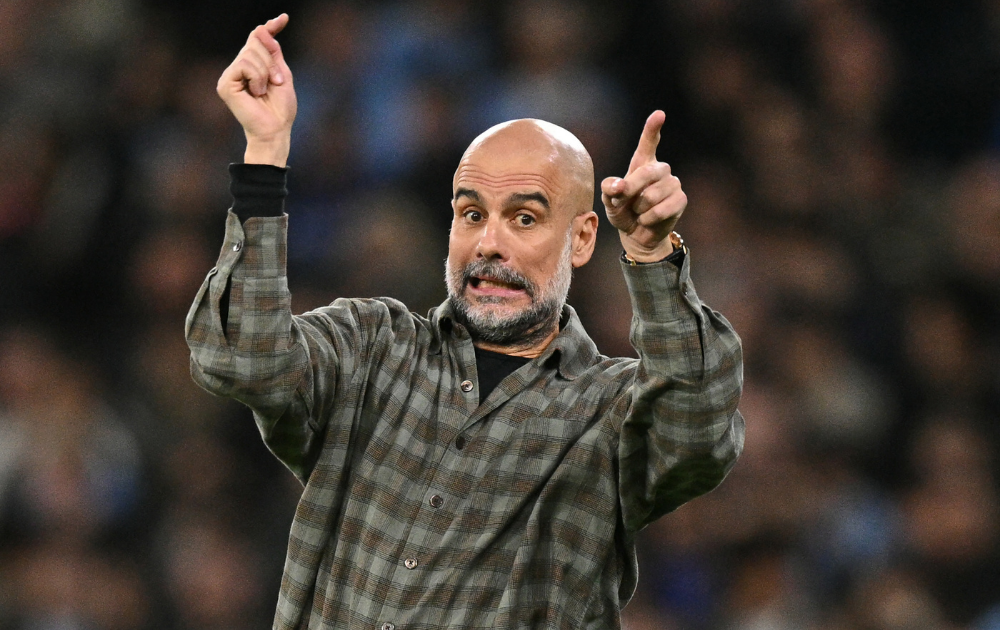 Manchester City's Spanish manager Pep Guardiola gestures on the touchline