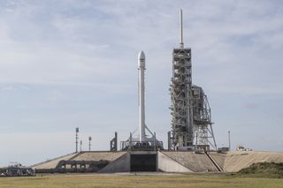 A SpaceX Falcon 9 rocket carrying the EchoStar 23 communications satellite is seen atop Launch Pad 39A at NASA's Kennedy Space Center in Florida ahead of its planned predawn launch on March 14, 2017.