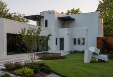A 1960s sculpture by American artist James Rosati stands in the garden of the Adah Robinson House in Tulsa, which was designed by Bruce Goff in 1925