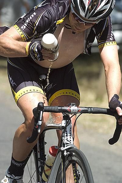 Early breakaway rider Benjamin King (Trek Livestrong) from Western Australia cools himself off in the searing heat in Buninyong.