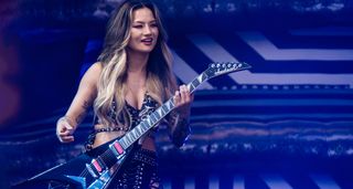 Kiki Wong plays a Jackson Rhoads as she performs with the Smashing Pumpkins in London 