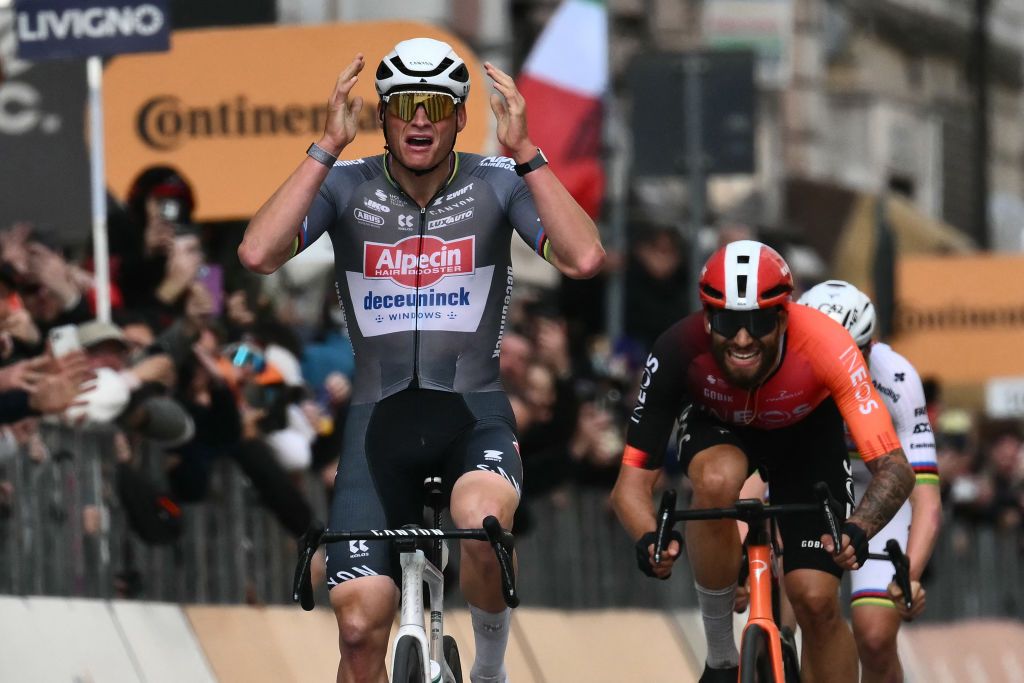 Dutch Mathieu Van Der Poel of team Alpecin-Deceuninck celebrates as he crosses the finish line to win the Milan - Sanremo one-day classic cycling race, on March 22, 2025. Dutch Mathieu Van Der Poel of team Alpecin-Deceuninck won the race ahead of Team Ineos' Italian rider Filippo Ganna and Team UAE's Slovenian rider Tadej Pogacar, third. (Photo by Marco BERTORELLO / AFP)