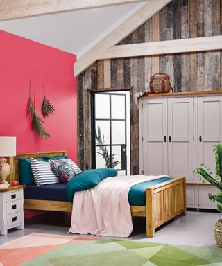 A white triple closet wardrobe in bedroom with pink wall paint decor