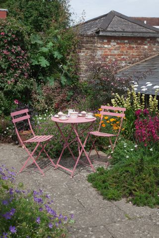 bistro dining set in a small garden