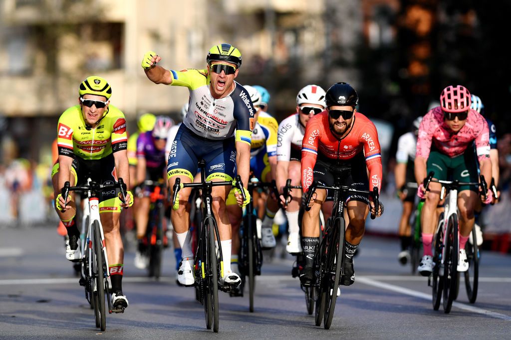 ROQUETAS DE MAR SPAIN FEBRUARY 13 Alexander Kristoff of Norway and Team Intermarch Wanty Gobert Matriaux celebrates winning ahead of Nacer Bouhanni of France and Team Arkea Samsic and Aniolkowski Stanislaw of Poland and Team Bingoal Pauwels Sauces WB during the 35th Clsica de Almera 2022 a 1882km one day race from El Ejido to Roquetas de Mar ClsicaAlmera22 on February 13 2022 in Roquetas de Mar Spain Photo by Tim de WaeleGetty Images