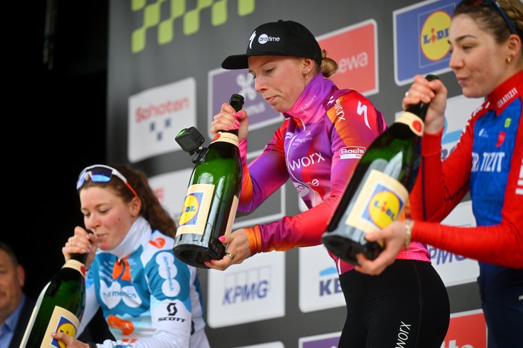 SCHOTEN BELGIUM APRIL 03 LR Charlotte Kool of The Netherlands and Team DsmFirmenich PostNl on second place race winner Lorena Wiebes of The Netherlands and Team SD WorxProtime and Martina Fidanza of Italy and Team CeratizitWNT Pro Cycling on third place celebrate on the podium ceremony after the 112th Scheldeprijs 2024 Womens Elite a 1305km one day race from Schoten to Schoten on April 03 2024 in Schoten Belgium Photo by Marc Van HeckeGetty Images