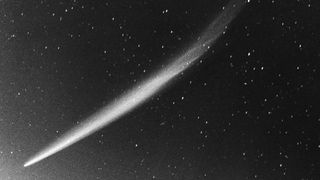 the white streak of a comet stretches from the bottom left upward right, against a black sky full of stars.Comet Ikeya-Seki was the brightest comet of the 20th century and at one point was visible in full daylight right next to the sun. This picture was captured on Oct. 30, 1965 showing the full extent of this great comet's tail of some 30 degrees.