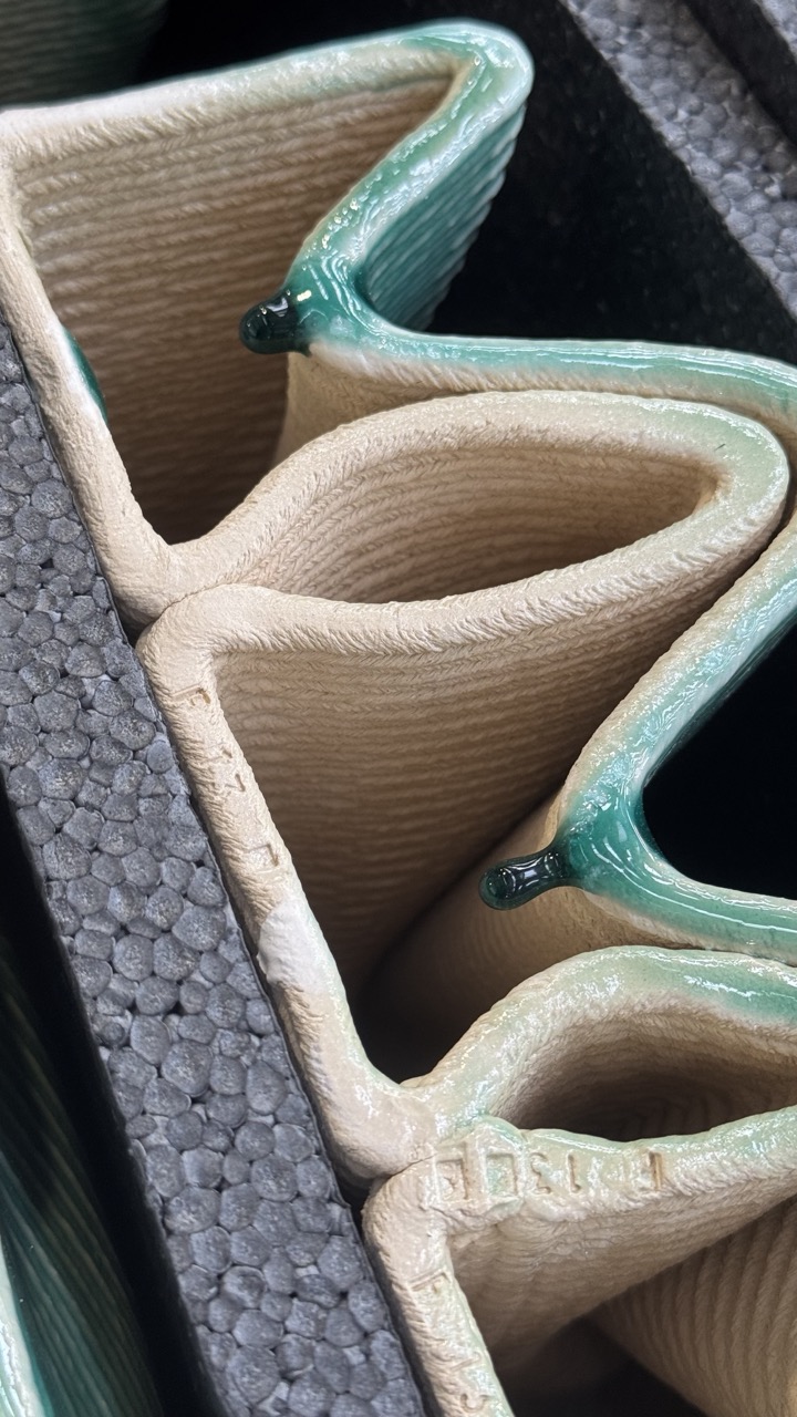 Side profile of the individual tiles, showing the layered build-up of the clay printing process