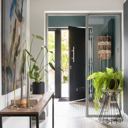 hallway with potted plants and wall painting