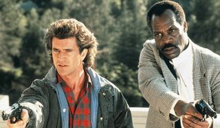 Lethal Weapon Mel Gibson and Danny Glover guns drawn at the tree lot