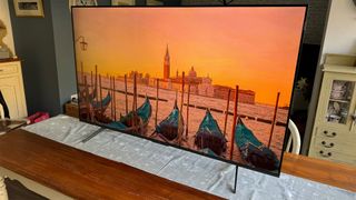 TCL C655K (55C655K) 55-inch TV on wooden table showing Venice on screen