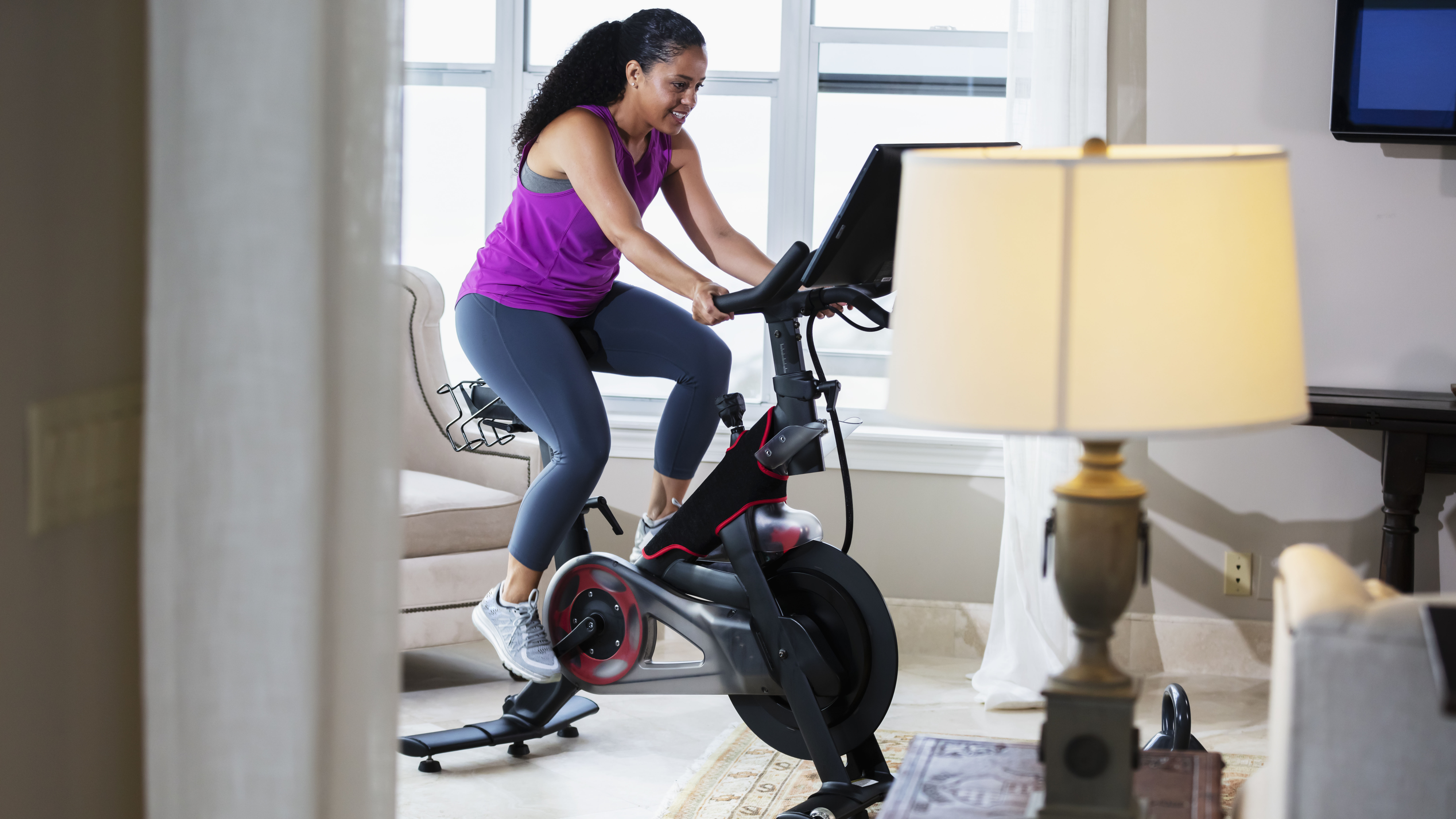 Person using exercise bike at home