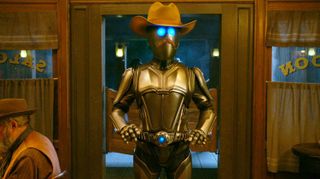  A golden cowboy robot wearing a hat from The Orville season 3 episode 4. 