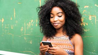 Woman looking at her phone, woman using social media