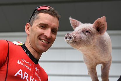 Laurent Pichon with a pig