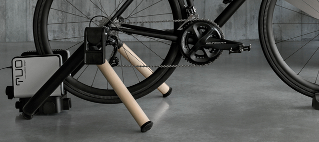 A black bike mounted to the Elite TUO smart wheel-on trainer