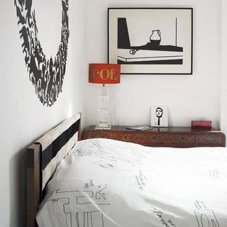 bedroom with lamp and frame