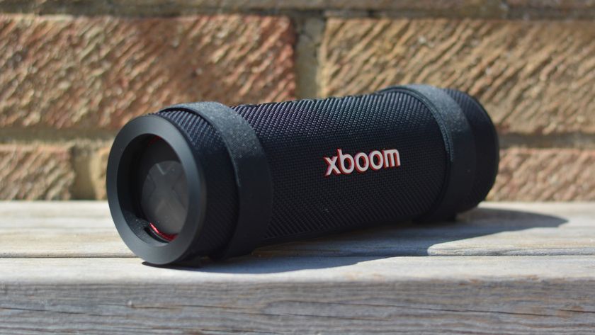 LG xboom Grab Bluetooth speaker in an outdoor setting