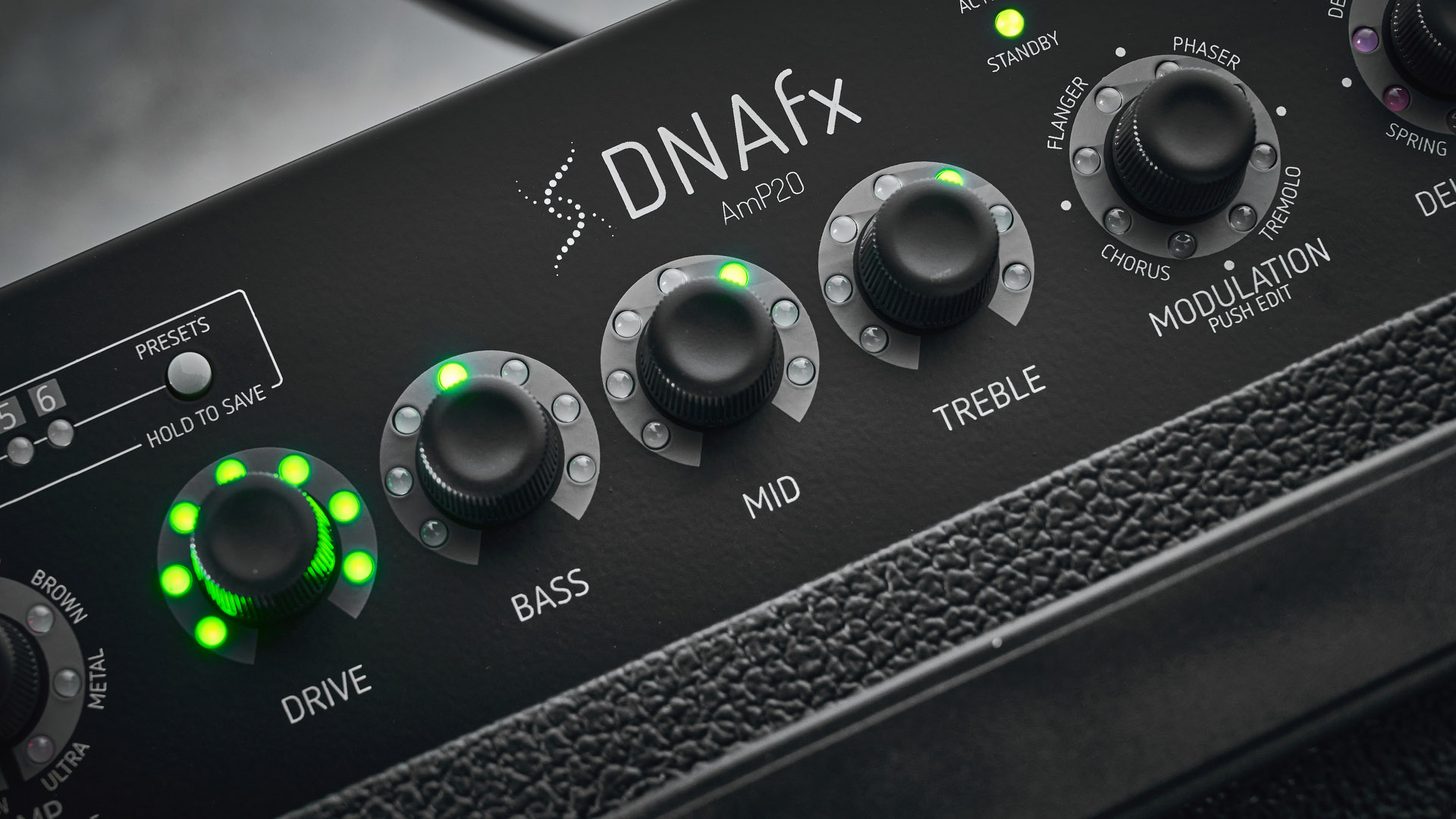 Harley Benton DNAFX AmP20: the compact 1/8&quot; modelling combo is finished in black and photographed in close-up and against a slate floor