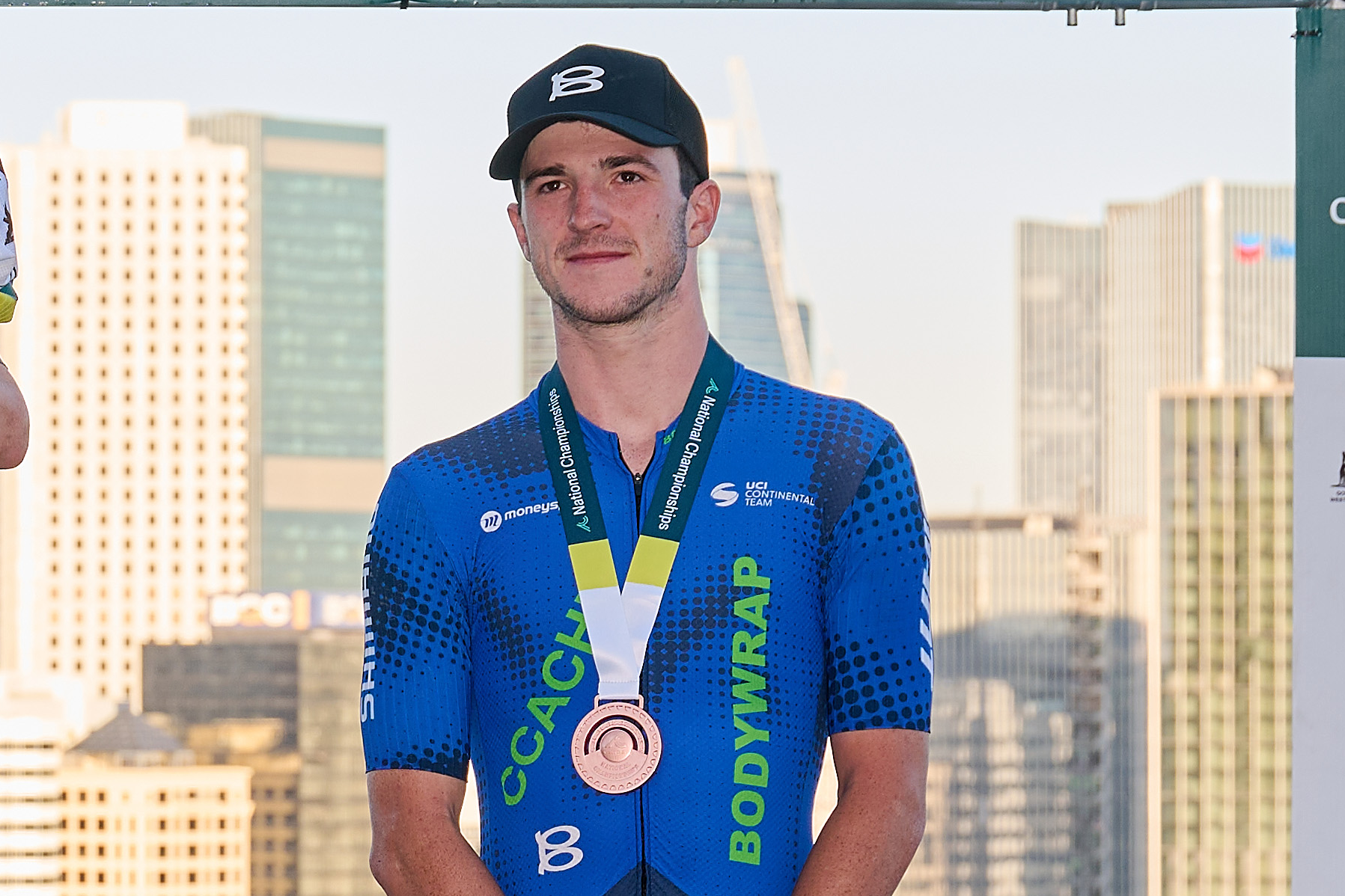 PERTH, AUSTRALIA - JANUARY 12: Lucas Plapp of team Jayco Alula, Luke Durbridge of team Jayco Alula, his son Henry Durbridge and Liam Walsh of team CCACHE x BODYWRAP on the podium after winning the Men&#039;s Elite Road Race as part of the 2025 Road Nats on January 12, 2025 in Perth, Australia. (Photo by Stefan Gosatti/Getty Images)