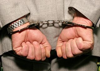 A handcuffed man.
