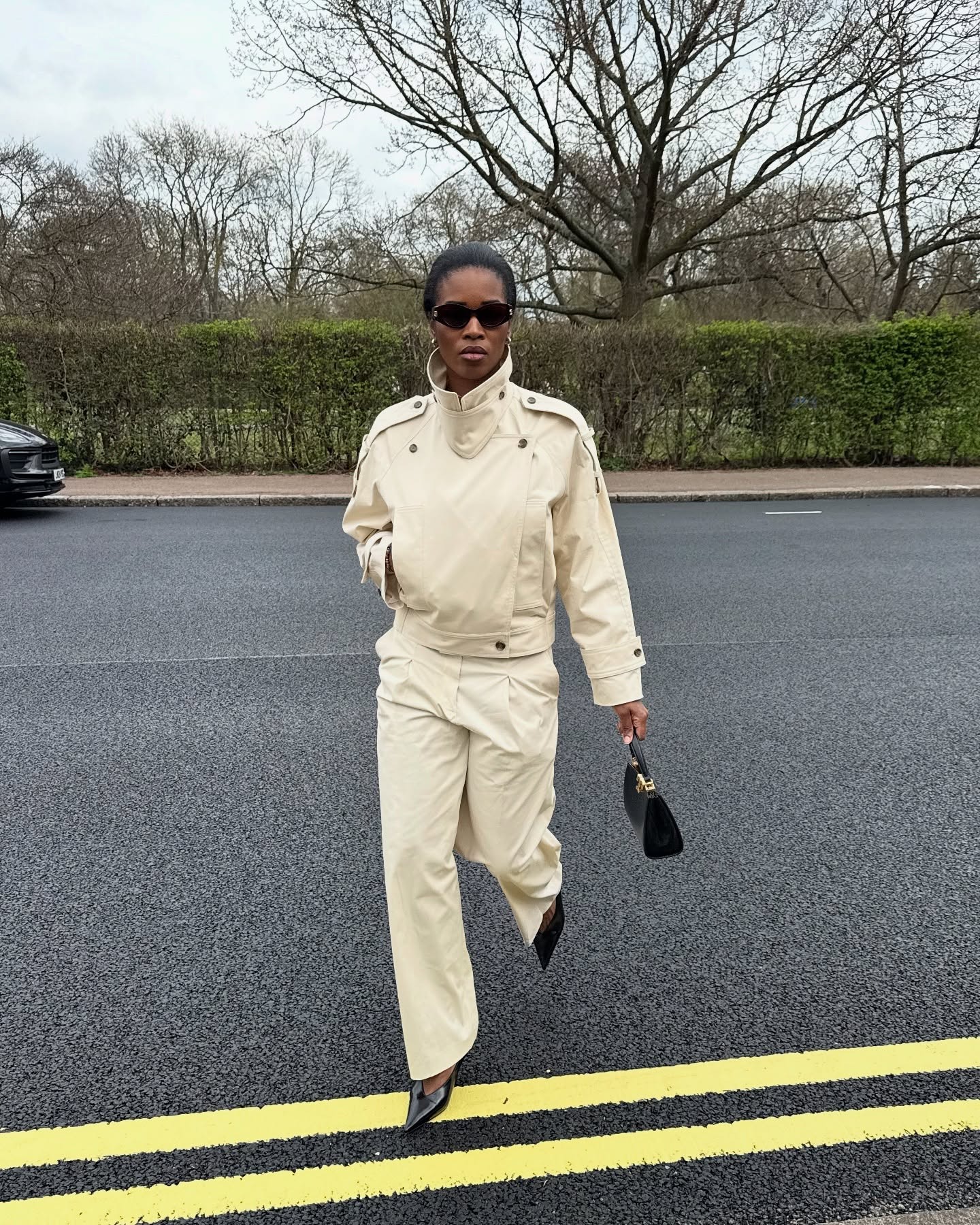 @nlmarilyn is wearing a chic trench coat outfit