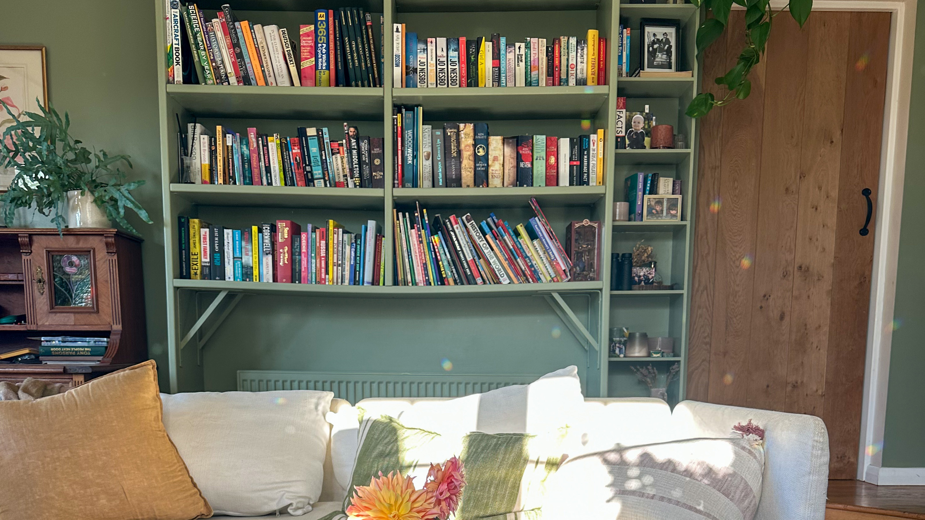 reading room with books on a green bookcase