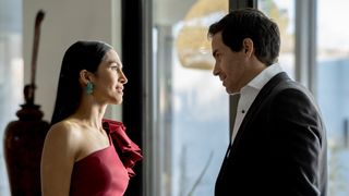 Elodie Yung and Santiago Cabrera in formal wear in The Cleaning Lady