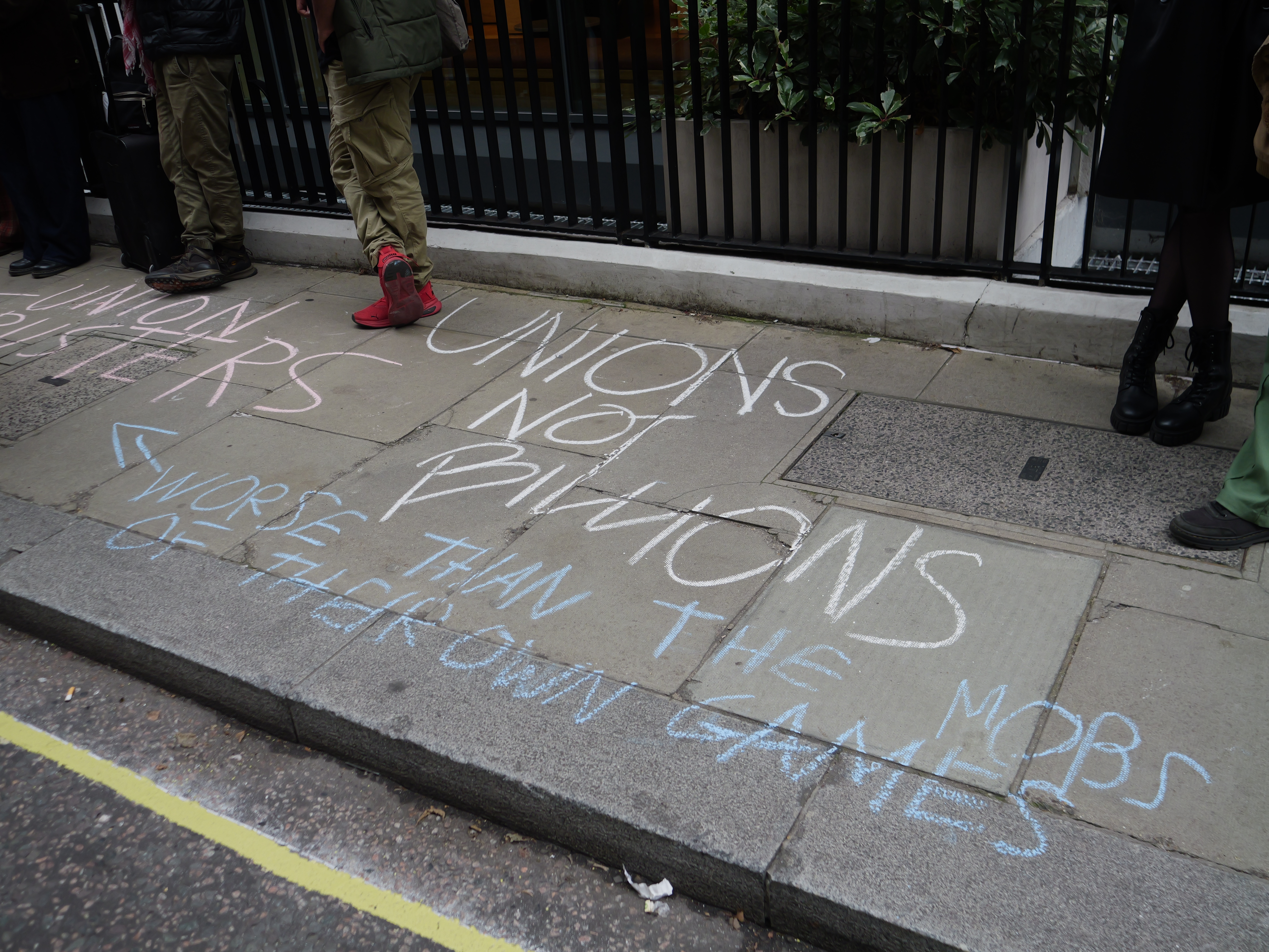 Pro-union slogans on the pavement in chalk.