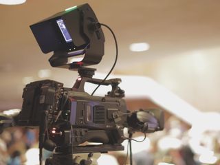 A JVC Professional camera films a house of worship production.