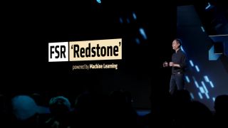 AMD's Jack Huynh on stage at Computex 2025 in front of an FSR 4 Redstone presentation